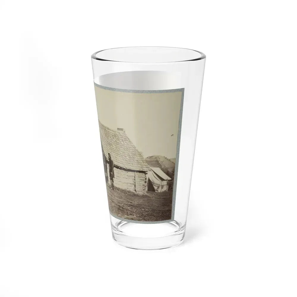 A Group Of Soldiers, And Two Young Men, One An African American, Stand Outside Of Log Cabin Quarters (U.S. Civil War) Pint Glass 16oz - Go Mug Yourself