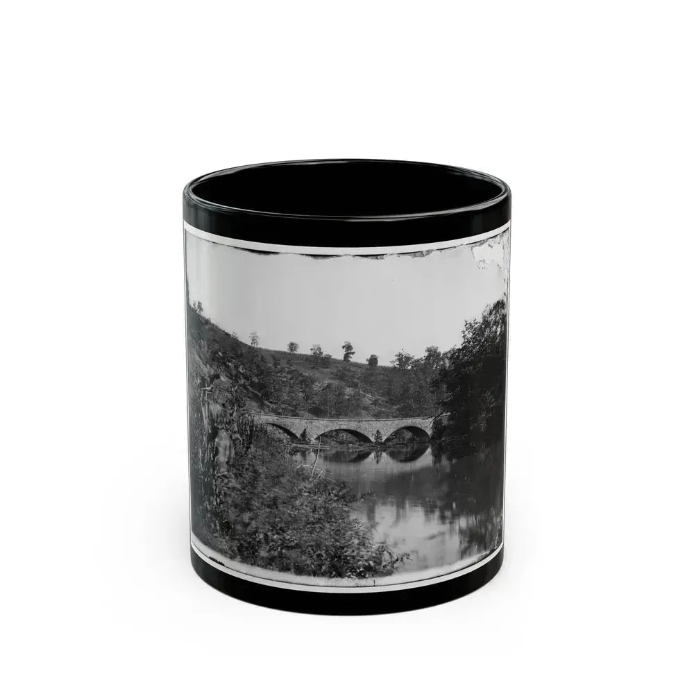 Antietam, Maryland. Antietam Bridge, Looking Down Stream (U.S. Civil War) Black Coffee Mug 11oz - Go Mug Yourself