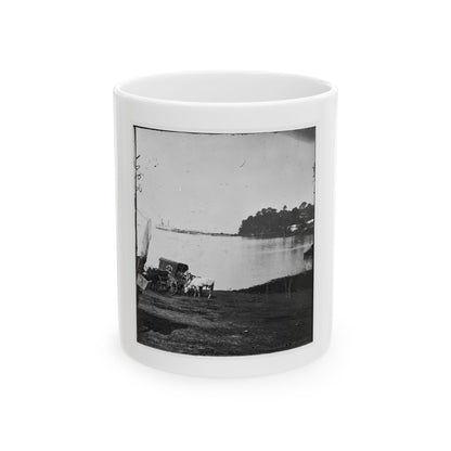 Black and white print of a white horse beside a covered mail wagon on a riverbank, with a steamboat.