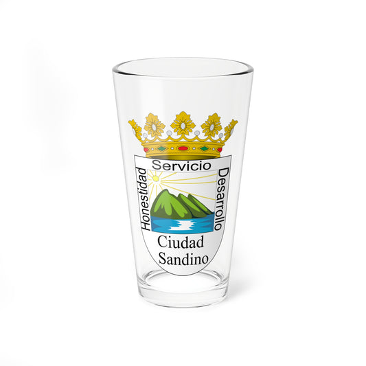 Gold crown above a coat of arms showing a sun over green mountains and blue water, with the words Ciudad Sandino.