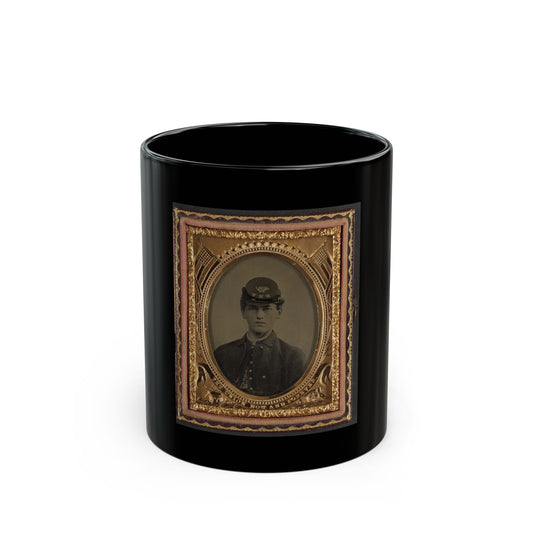 Sepia tintype portrait of a young Union soldier in a kepi, set in an ornate gold oval frame with flags and stars.