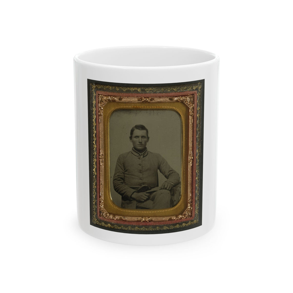 Sepia tintype portrait of a seated soldier in a buttoned grey coat, set in a gilt case lined with red velvet.