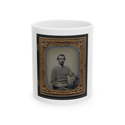 Antique tintype portrait of a bearded man in a grey double-breasted military coat, seated in an embossed gilt frame.