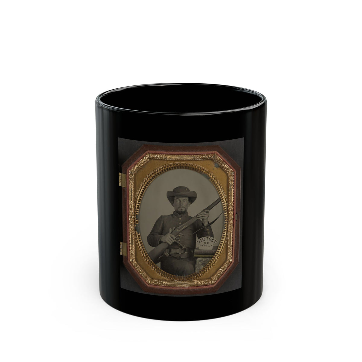 Antique tintype of a seated soldier in a slouch hat holding a rifle beside a card reading Victory or Death.