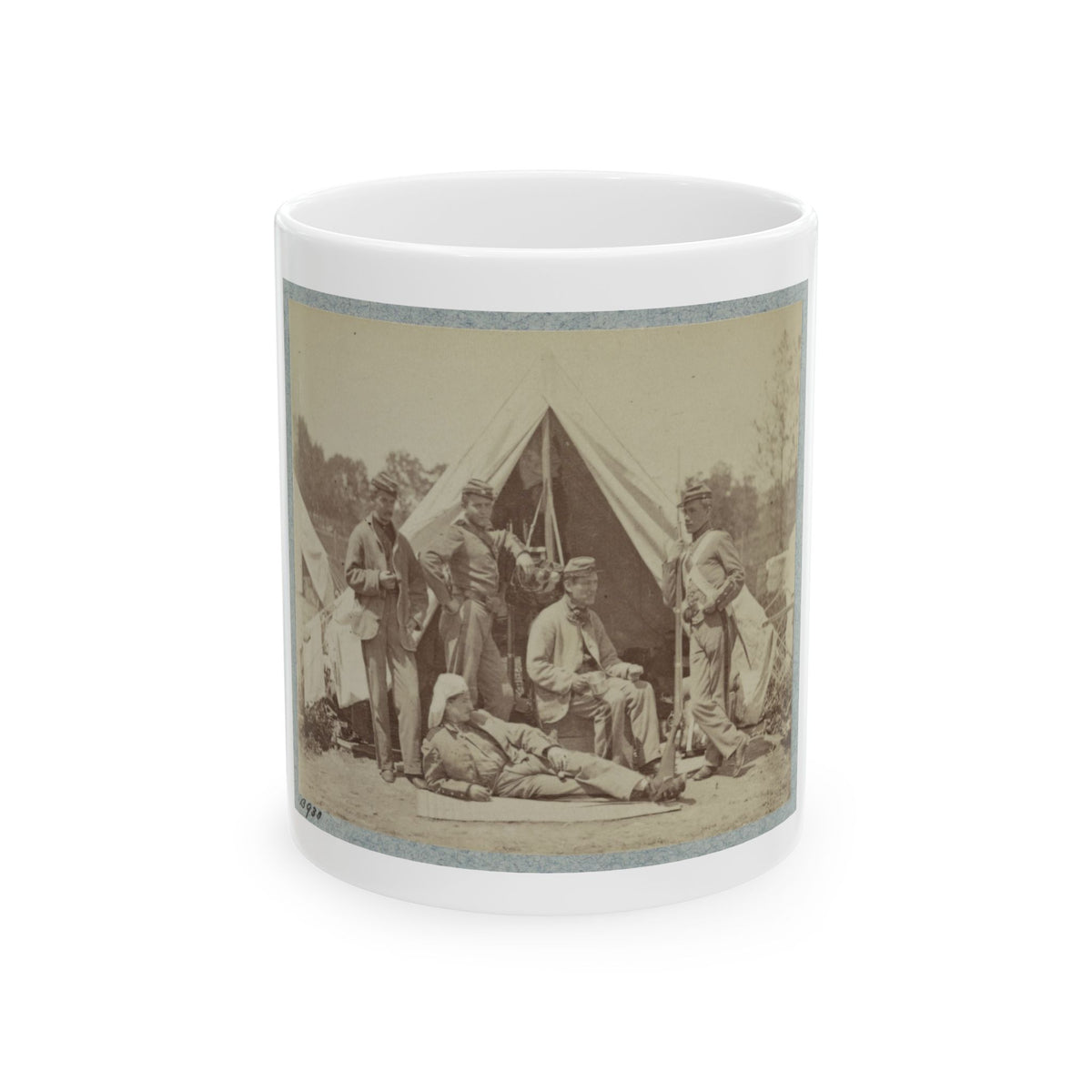 Sepia print of five soldiers posed before a white canvas tent, one reclining in front and one holding a rifle.