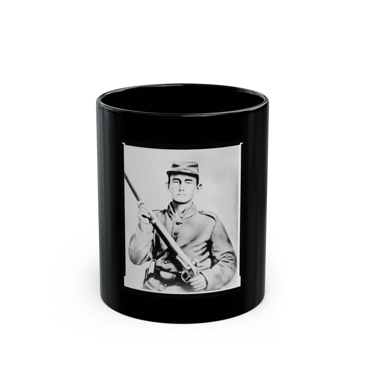 Black and white portrait of a young soldier in a kepi cap holding a rifle across his chest against a pale backdrop.