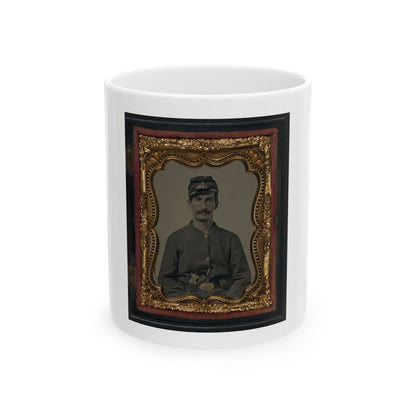 Antique hand-tinted tintype of a moustached soldier in a forage cap and grey jacket, set in an ornate gilt frame.