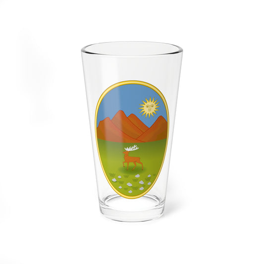 Gold-framed oval landscape with a brown stag with white antlers on green meadow, red mountains and a faced sun.