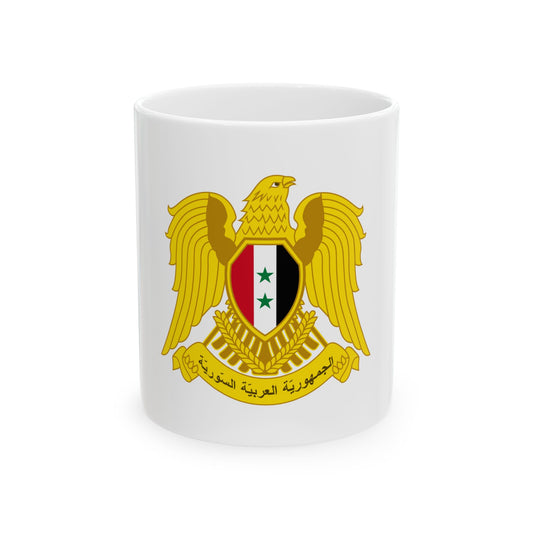 Gold eagle with spread wings above a red, white and black shield with two green stars, wheat and an Arabic banner.