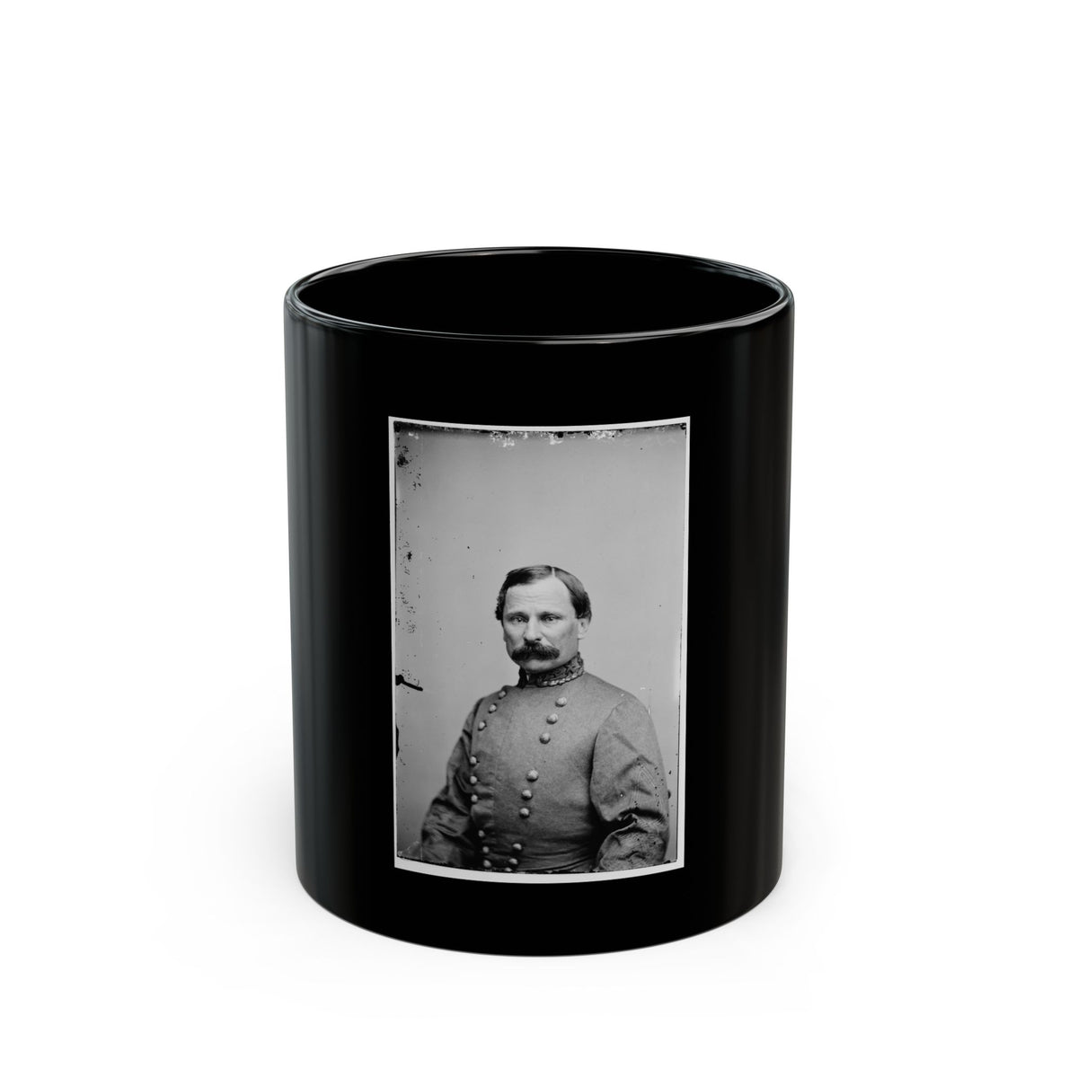Black and white 1860s studio portrait of a mustached man in a double-breasted coat with an embroidered collar.