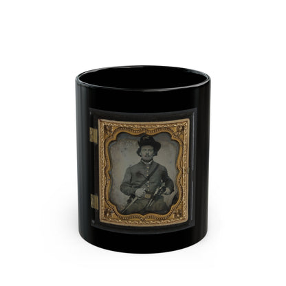 Sepia tintype of a young soldier in a slouch hat holding a sword and revolver, set in a scalloped gilt case.