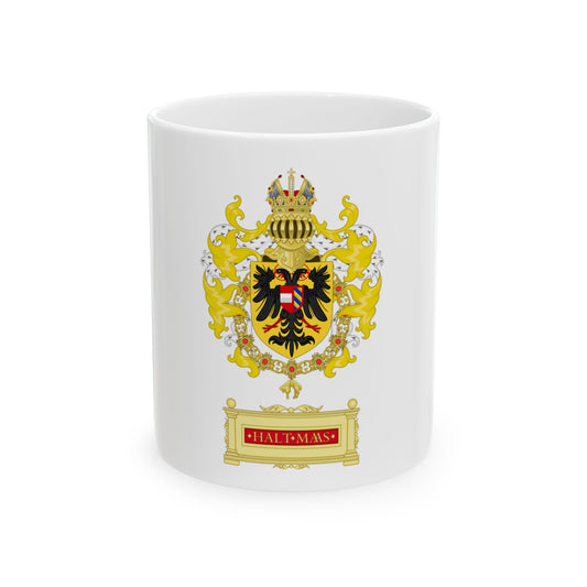 Gold heraldic crest with a black double-headed eagle on a shield, a crown above and a gold plinth below.