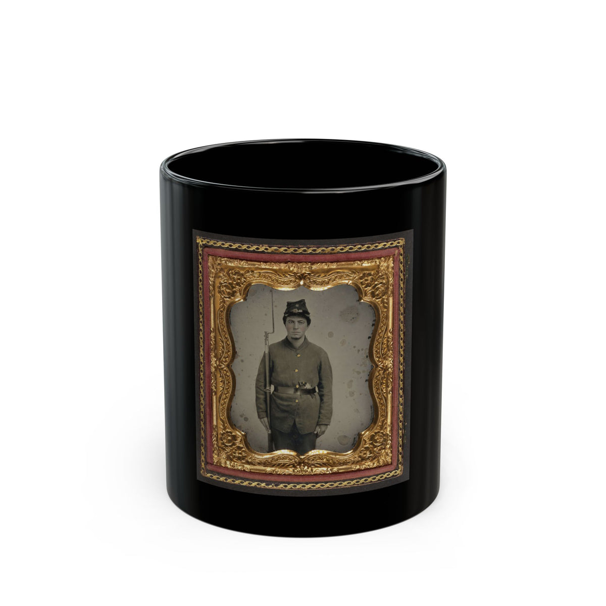 Antique tintype of a standing young soldier in a kepi holding a rifle with bayonet, in an ornate gold floral frame.