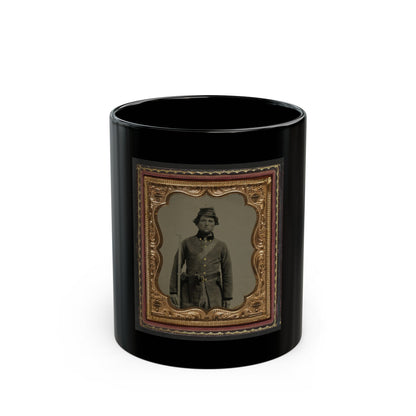Sepia tintype of a standing soldier in a kepi with a rifle, set in an embossed gold scalloped frame inside a case.