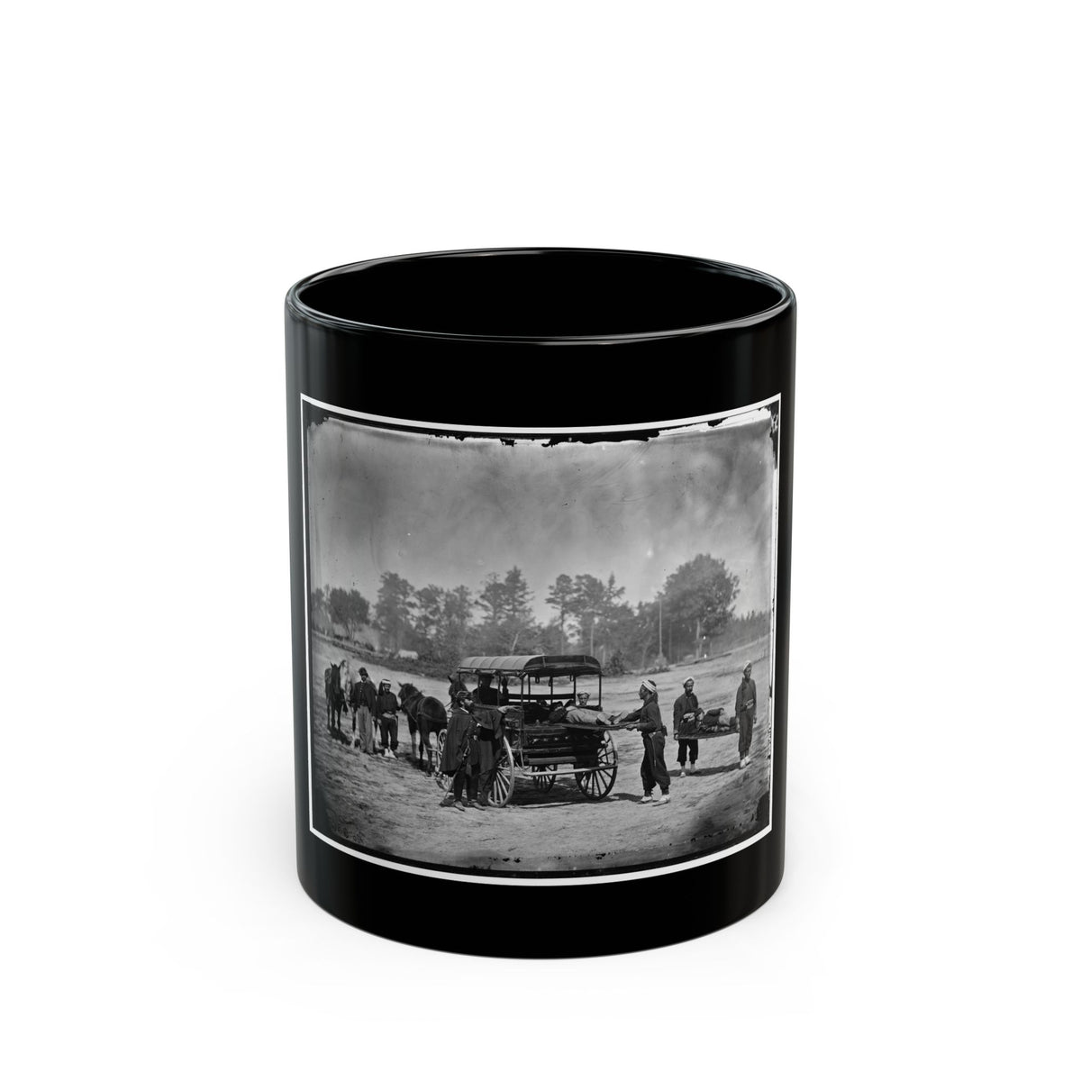Black-and-white 1860s scene of stretcher bearers and an ambulance wagon carrying wounded men across a sandy field.