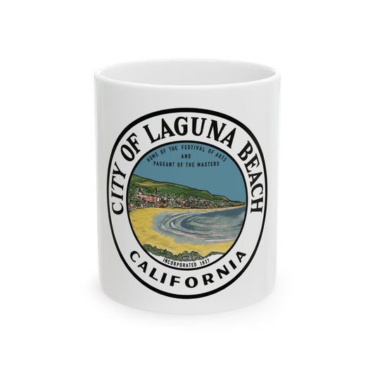 Round badge with a painted coastal town, sandy beach and bay, ringed by lettering for Laguna Beach, California.