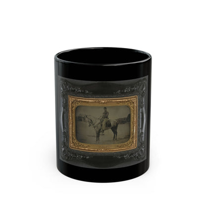 Antique tintype of a soldier in a forage cap riding a grey horse across an open field, in an embossed case.