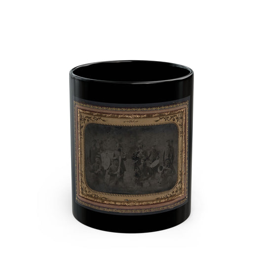 Sepia tintype of about ten brass band musicians with cornets, horns and a drum, set in an ornate gilt frame.