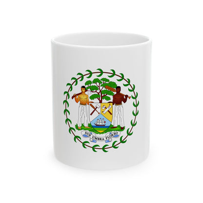 Circular Belize coat of arms with two men holding axes beside a mahogany tree, a ship, and the motto SUB UMBRA FLOREO.