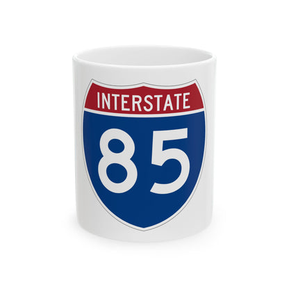 Flat vector US Interstate 85 route shield with a red top band reading INTERSTATE and white numerals 85 on navy.