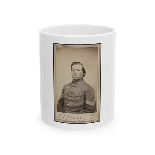 Sepia carte de visite portrait of a young soldier in a buttoned infantry jacket with a chevron on the sleeve.