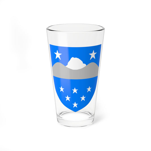 Blue shield emblem with eight white stars arranged below a snowy peak above a grey mountain range.
