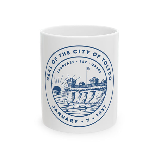 Blue monochrome circular seal of Toledo, Ohio, showing a wooden stockade fort on a bluff above water at sunrise.