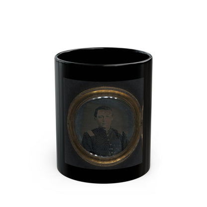 Small antique tintype of a young man in a dark military jacket with shoulder straps, in a round brass locket case.