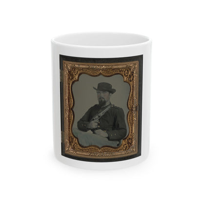 Antique tintype of a bearded man in a slouch hat holding a rifle across his lap, in a gilt floral case.