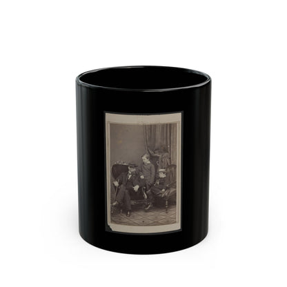 Sepia studio portrait of a bearded man in a kepi seated with two young boys, one wearing a straw boater hat.