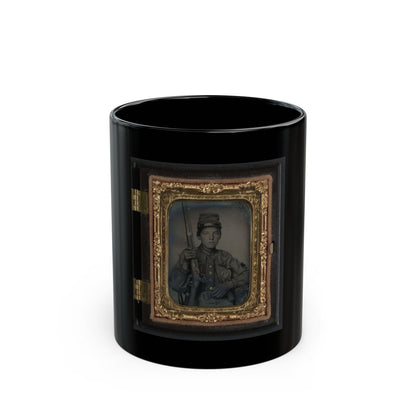 Hand-tinted 1860s tintype of a young soldier in a kepi holding a rifle upright, framed in an ornate gilt case.