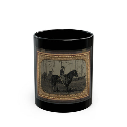 Sepia print of a mounted soldier with a sabre on a dark horse, in a military camp with log huts and tents.