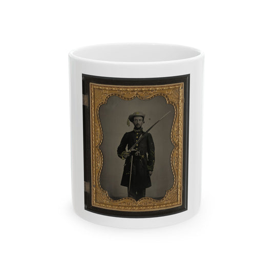 Hand-coloured tintype of a standing 19th-century soldier holding a sabre, set in an ornate gilt case frame.