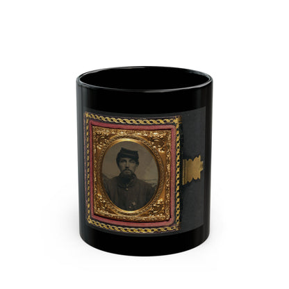 Tintype portrait of a bearded man in a forage cap and dark jacket with a small cross insignia, in an ornate gold frame.