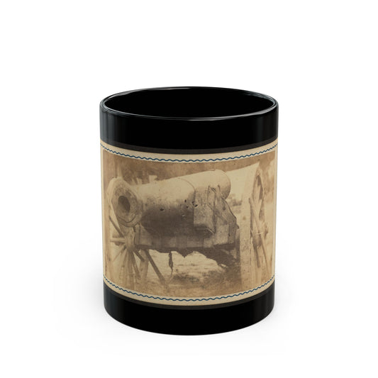 Sepia scene of a muzzle-loading cannon on a spoked wooden carriage, framed by a card with a wavy blue border.