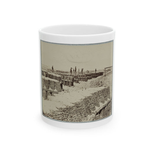 Sepia print of woven wicker baskets forming earthworks, with small figures standing on the ramparts.