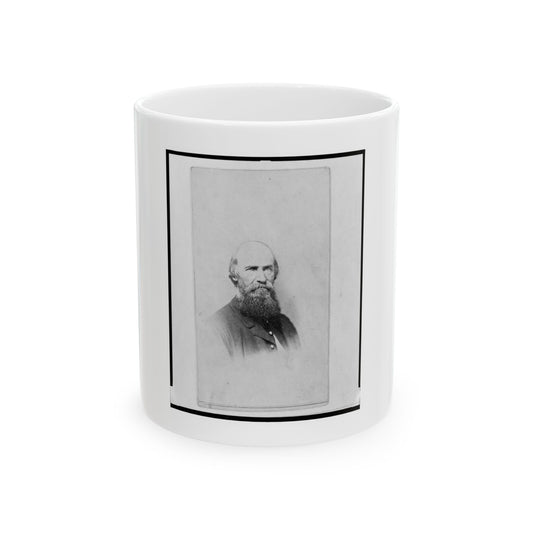Black and white 1860s portrait of a bald, bearded older man in a dark jacket against a pale studio backdrop.