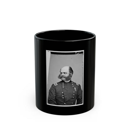 Black and white 1860s studio portrait of a mustached officer in a dark coat with star shoulder straps.