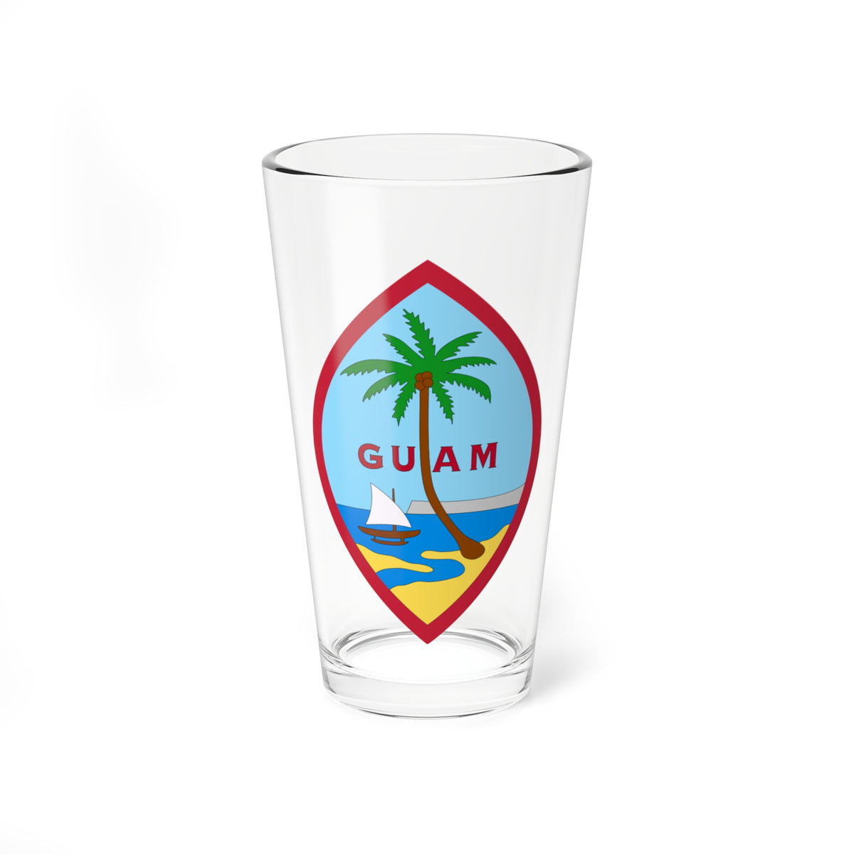 Pointed oval emblem with a red border showing a palm tree, a sailboat on blue water and a sandy beach, lettered GUAM.