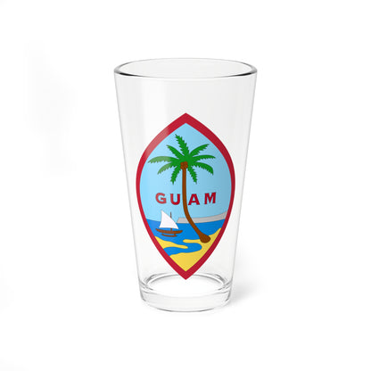 Pointed oval emblem with a red border showing a palm tree, a sailboat on blue water and a sandy beach, lettered GUAM.