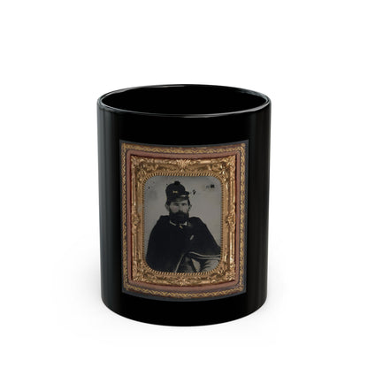 Antique tintype portrait of a bearded man in a dark cape and kepi, set in an ornate gilt case.