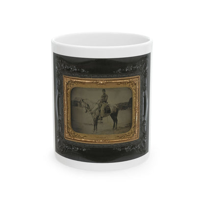 Antique tintype of a soldier in a forage cap riding a grey horse across an open field, in an embossed case.