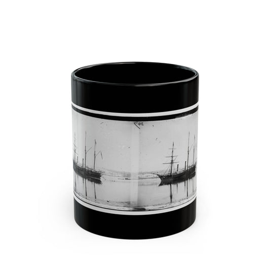 Black and white stereo view of two steamships at anchor on still water, with their reflections below.