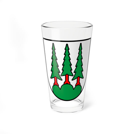 Three green fir trees on red trunks standing on a green mound within a white heraldic shield outlined in black.