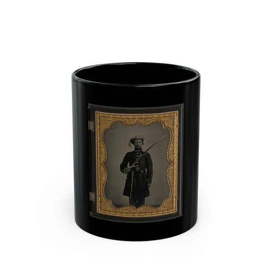 Hand-coloured tintype of a standing 19th-century soldier holding a sabre, set in an ornate gilt case frame.