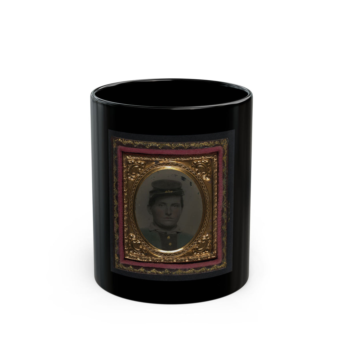 Tintype of a young man in a dark forage cap, shown head and shoulders inside a gilt oval frame with pink velvet.
