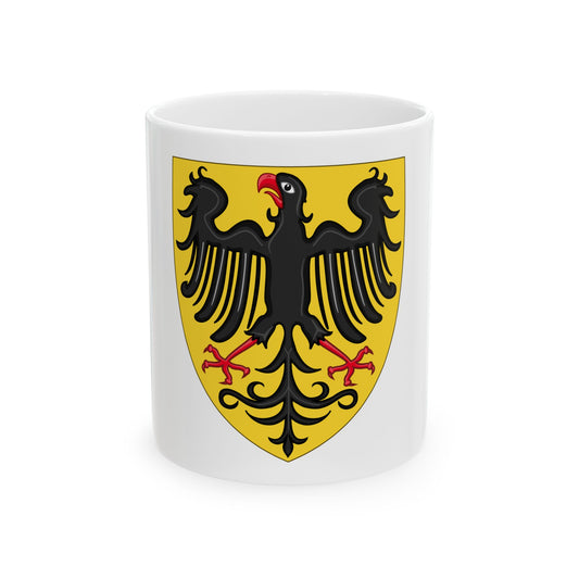 Black heraldic eagle with spread wings and red talons and beak on a gold pointed shield, medieval in style.