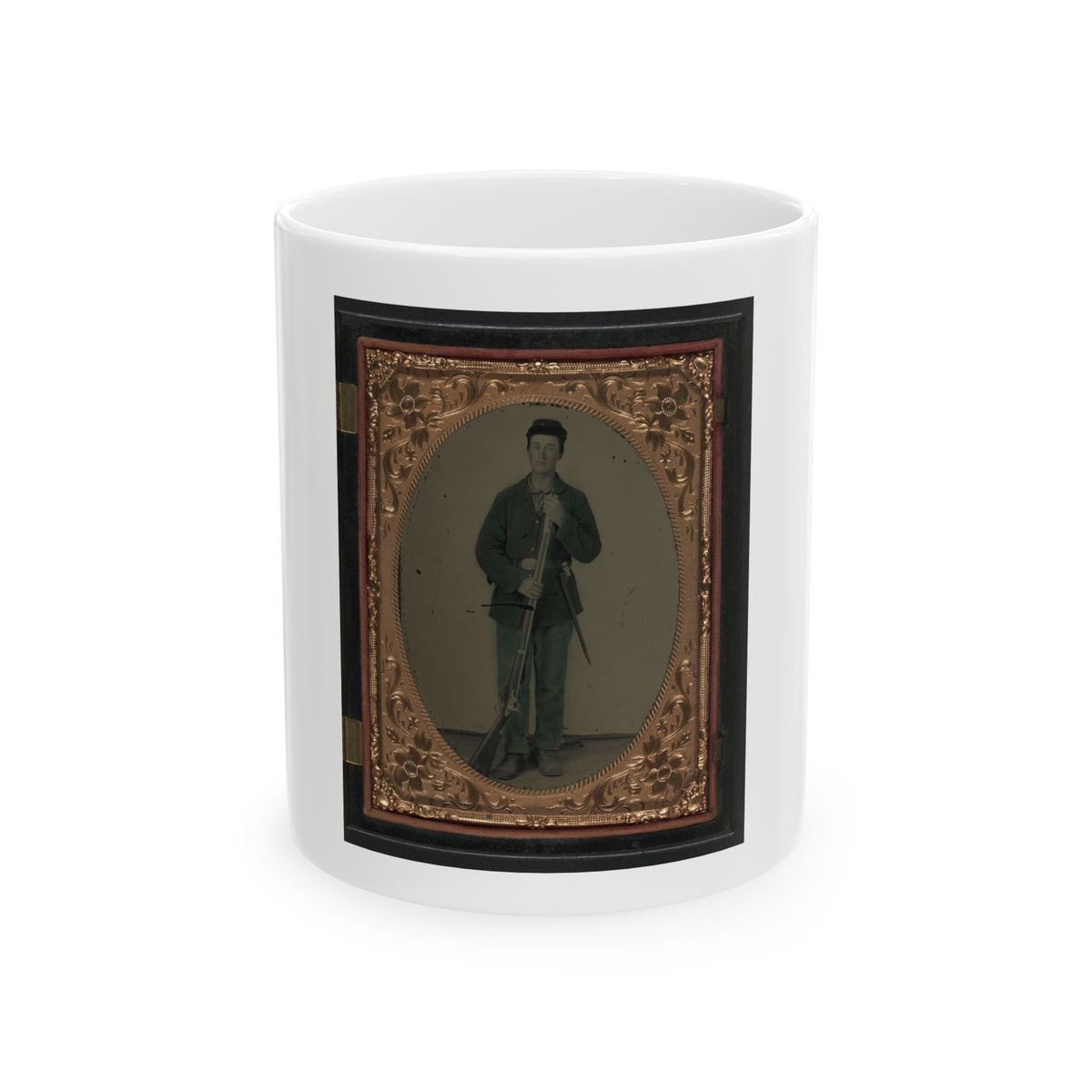Hand-tinted tintype of a standing soldier in a kepi holding a musket, framed in an embossed copper-gold oval mat.