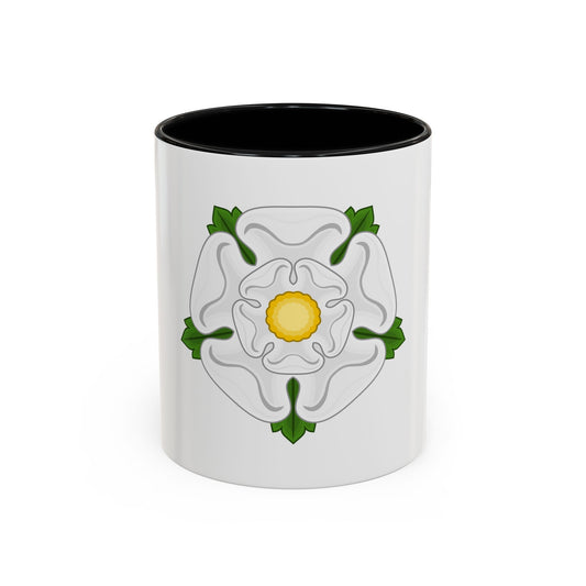 A white five-petalled heraldic rose with a yellow centre, edged with green sepals and leaves.