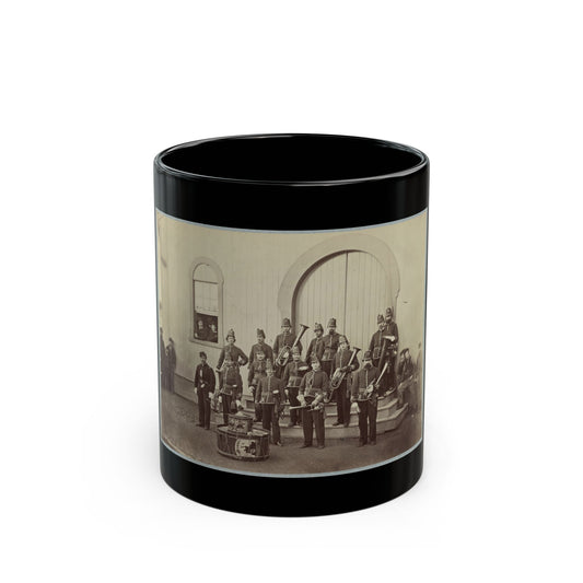 Sepia 19th-century view of a uniformed military band with brass instruments before an arched wooden doorway.